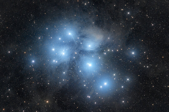 Pleiades, M45. A bright open star cluster surrounded by reflection nebulosity in the Taurus constellation. High quality photo