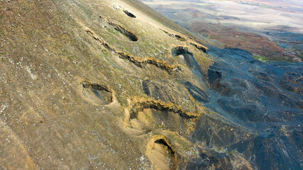 Obraz premium Aerial view of the ancient volcanic fumaroles of the Gairia Caldera, in Fuerteventura, Spain.