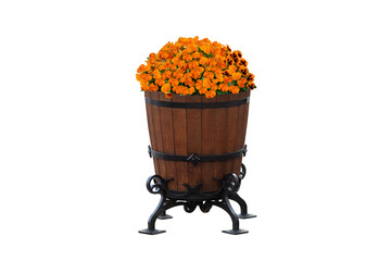 Bright orange flowers fill a decorative wooden barrel planter set on an iron stand