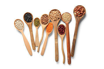 Wooden spoons with different legumes on white background