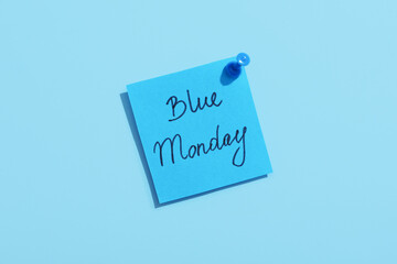 Paper sheet with written text BLUE MONDAY