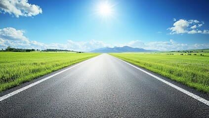 Empty Road Leading Towards Mountains Under Blue Sky With Clouds