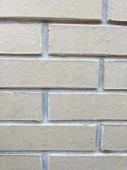 Texture of light colored bricks on a building wall