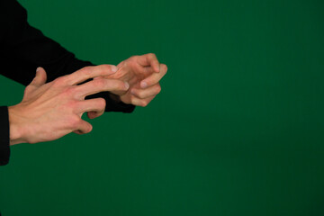 hand holding on green screen background. High quality photo