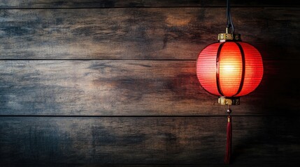 Red Paper Lantern Illuminating Rustic Wooden Background at Night