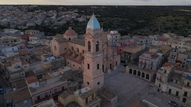 dusk flying counter clockwise around church in Ispica Sicily