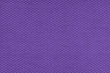 Plain purple jacquard upholstery fabric, satin material with woven structure, pattern texture background. Close up, macro cloth textile surface. Wallpaper, backdrop with copy space