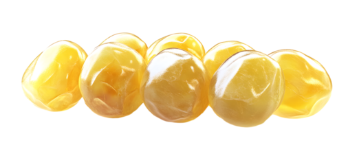 Close-up of glossy yellow marbles on a white background creating a vibrant visual impact