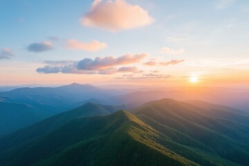The sun is setting over a mountain range, casting a warm glow over the landscape. The sky is filled with clouds, creating a serene and peaceful atmosphere