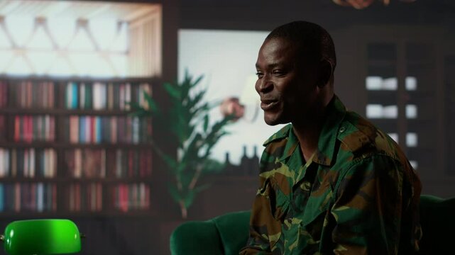 Black distraught war veteran crying due to shell shock and combat flashbacks, cure his anxiety after traumatic experiences. Army soldier dealing with a mental disorder during therapy. Camera B.