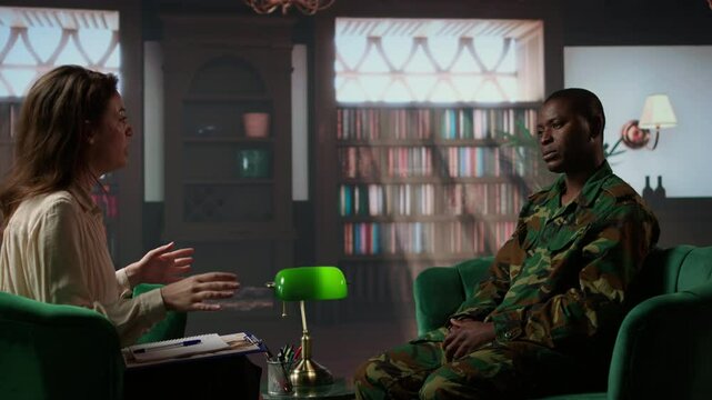 African american military trooper sharing flashbacks from the war during counseling session, tying to cure PTSD and shell shock. Army veteran deals with depression after traumatic scenes. Camera A.