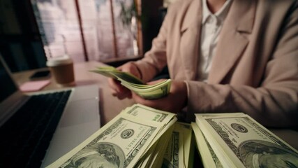 Close up unrecognizable Caucasian business woman female freelancer girl rich successful businesswoman wealthy accountant winner counting money cash wage dollars salary laptop device prize win office