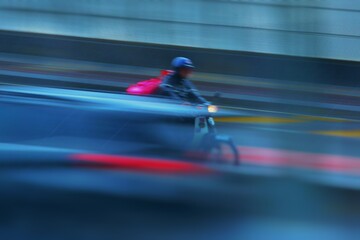 Obraz premium Motorcycles move fast on the road on a rainy day