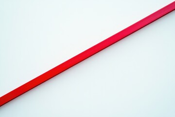 A single red line diagonally positioned against a white background, minimalist design.