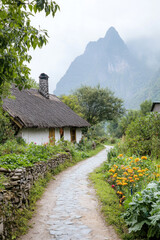 View of green mountain mist with thatched house and small vegetable garden