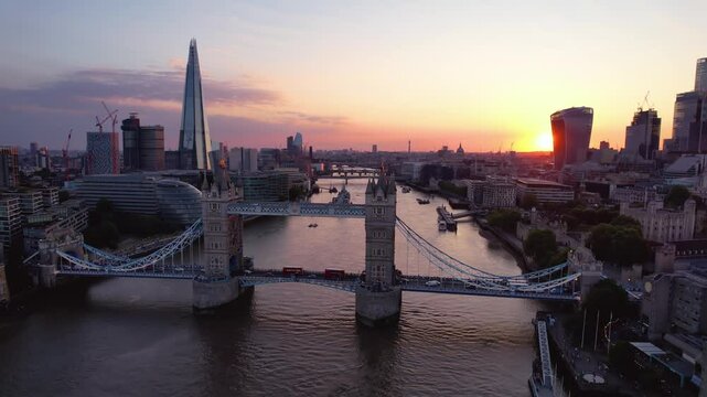 LONDON - 7.11.2024 - Very good aerial footage circling clockwise around London Bridge and the Shard at sunset.