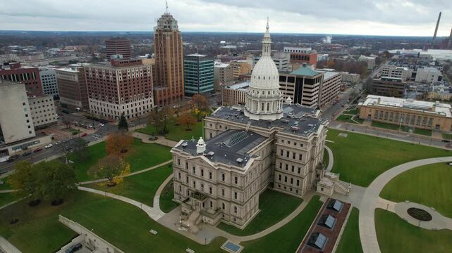 LANSING - 12.5.2024 - Excellent aerial footage circling clockwise around the Michigan State Capitol.