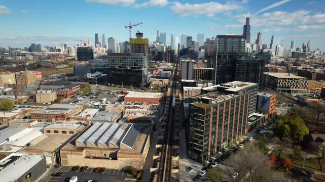 CHICAGO - 12.5.2024 - Gorgeous aerial footage of an elevated train traveling into downtown Chicago.
