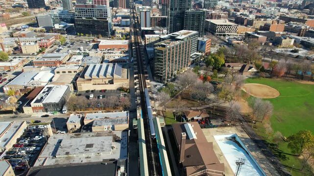 CHICAGO - 12.5.2024 - Excellent aerial footage following an elevated train into downtown Chicago.