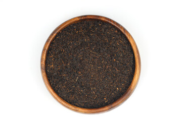 Dry black tea leaves isolated on white background, top view