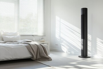 A sleek black bladeless fan is placed on the floor of a stylish white bedroom providing a cool refreshing atmosphere for summer