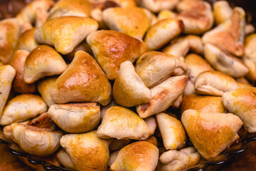 Brazilian meat esfirra, stuffed with pepperoni, cheese and Noida meat, typical savory snack at parties and events