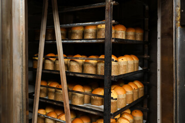 A rack of breads with a ladder to reach them, Easter baking at the factory