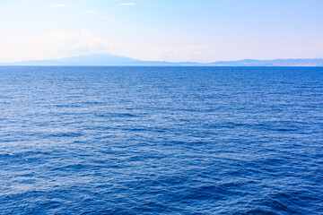 The ocean is calm and blue, with no visible land in the distance