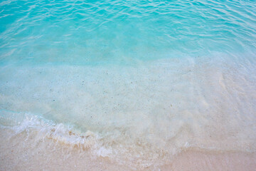 A beautiful blue ocean with a sandy beach