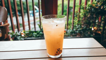 Brazilian Passion Fruit drink with a blurred green background. Tropical vibes