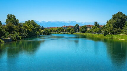 Serene river scene with cityscape and mountains under a clear blue sky. (1)