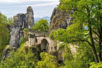 Bastei Bridge nestled within the dramatic Elbe Sandstone Mountains at Saxon Switzerland National Park, Saxony, Germany