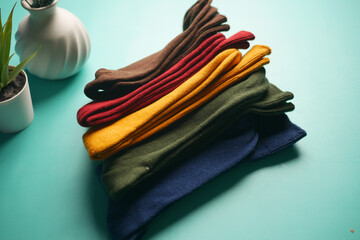 Explore our vibrant and colorful socks collection showcased beautifully on a mint background