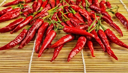 Bright Red Chili Peppers Laid Out to Dry on a Large Bamboo Mat