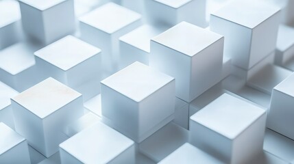 Fototapeta premium A close-up view of white cubes arranged in a structured layout, creating a modern and minimalist aesthetic.