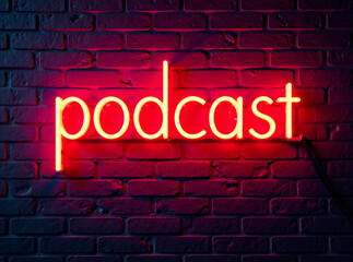 Fototapeta premium PODCAST neon sign illuminating brick wall, glowing text banner for night show, radio style illuminated logo, music broadcast symbol in neon lights