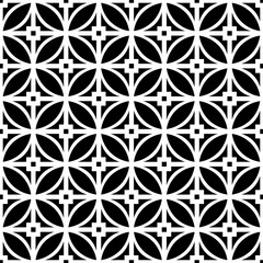 Fototapeta premium Seamless black and white geometric pattern, featuring a symmetrical design with floral motifs. Suitable for backgrounds, wallpapers, textiles, prints and various artistic projects.