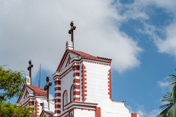 Architectural details of a church against a vibrant blue sky.  A testament to faith and artistry.