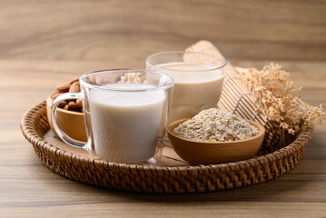 Alternative milk made from plant on wooden background, non dairy, Vegan food