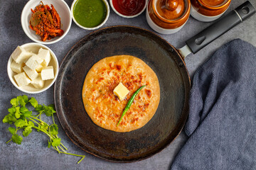 Paneer ka paratha is a soft, flavorful Indian flatbread stuffed with spiced cottage cheese, served hot with chutney or yogurt.