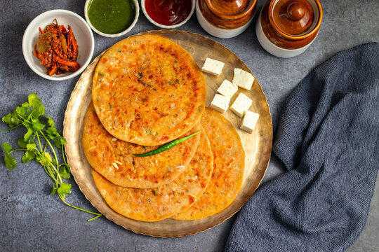Paneer ka paratha is a delicious Indian flatbread stuffed with spiced paneer, served hot with chutney, curd, or pickle.