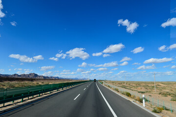 Desert road sand dunes in Xinjiang, China