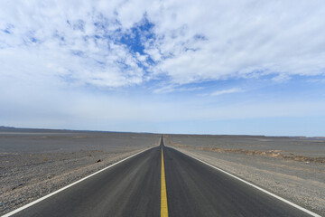 Desert road sand dunes in Xinjiang, China