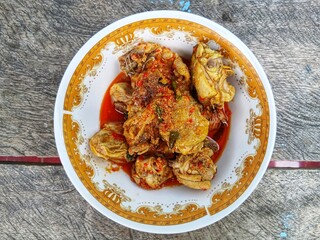 Ayam Woku, a typical chicken dish from Manado, North Sulawesi, Indonesia. Which has a rich aroma and a spicy taste

