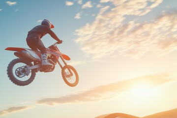a motocross rider soaring