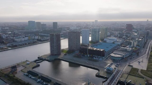 Cityscape of Antwerp city and vast river Schelde, aerial view