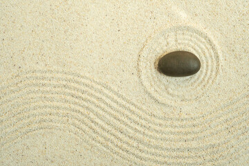 Top view of background and backdrop on sand The concept of balancing stones in a Japanese Zen garden