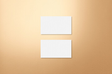Business Card Mock up on Light Gold Background.