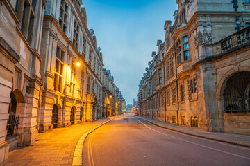 Illuminated Pembroke street at dawn in Cambridge. England