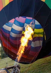 A hot air balloon with a fire coming out of it
